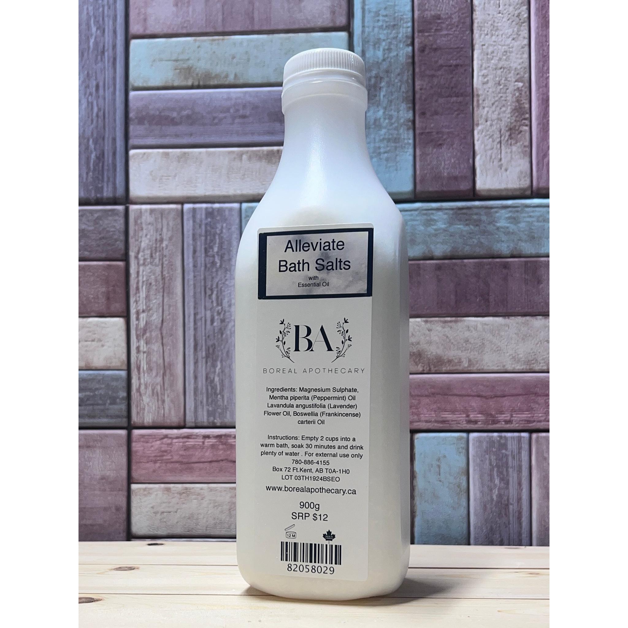 Bottle of 'Alleviate Bath Salts' with a wooden background