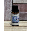 Bottle of Nightshade Fragrance Oil by Boreal Apothecary on a wooden surface