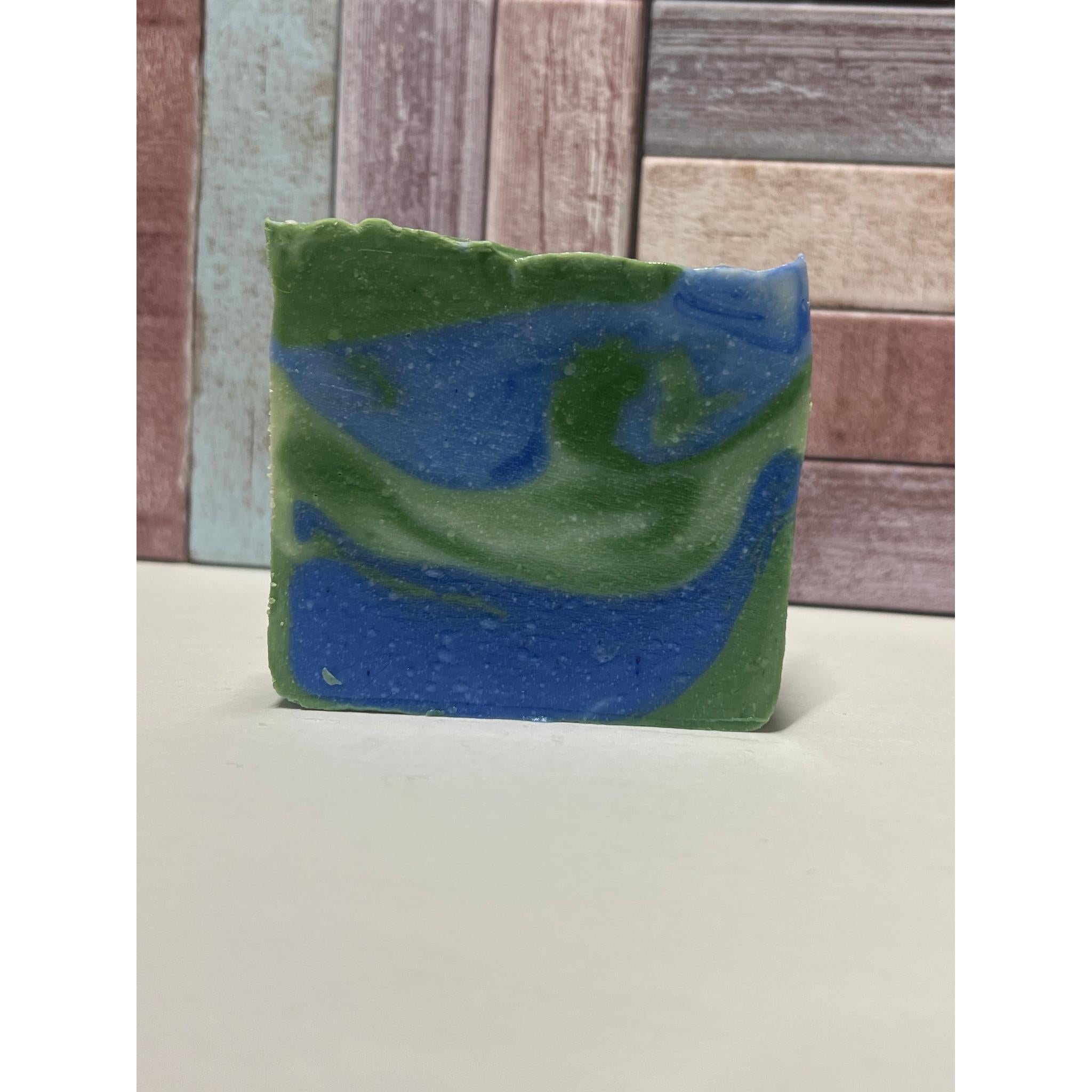 Green and blue soap bar on a neutral background