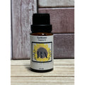 Bottle of Sunflower Fragrance Oil by Boreal Apothecary on a wooden surface with a wooden background.