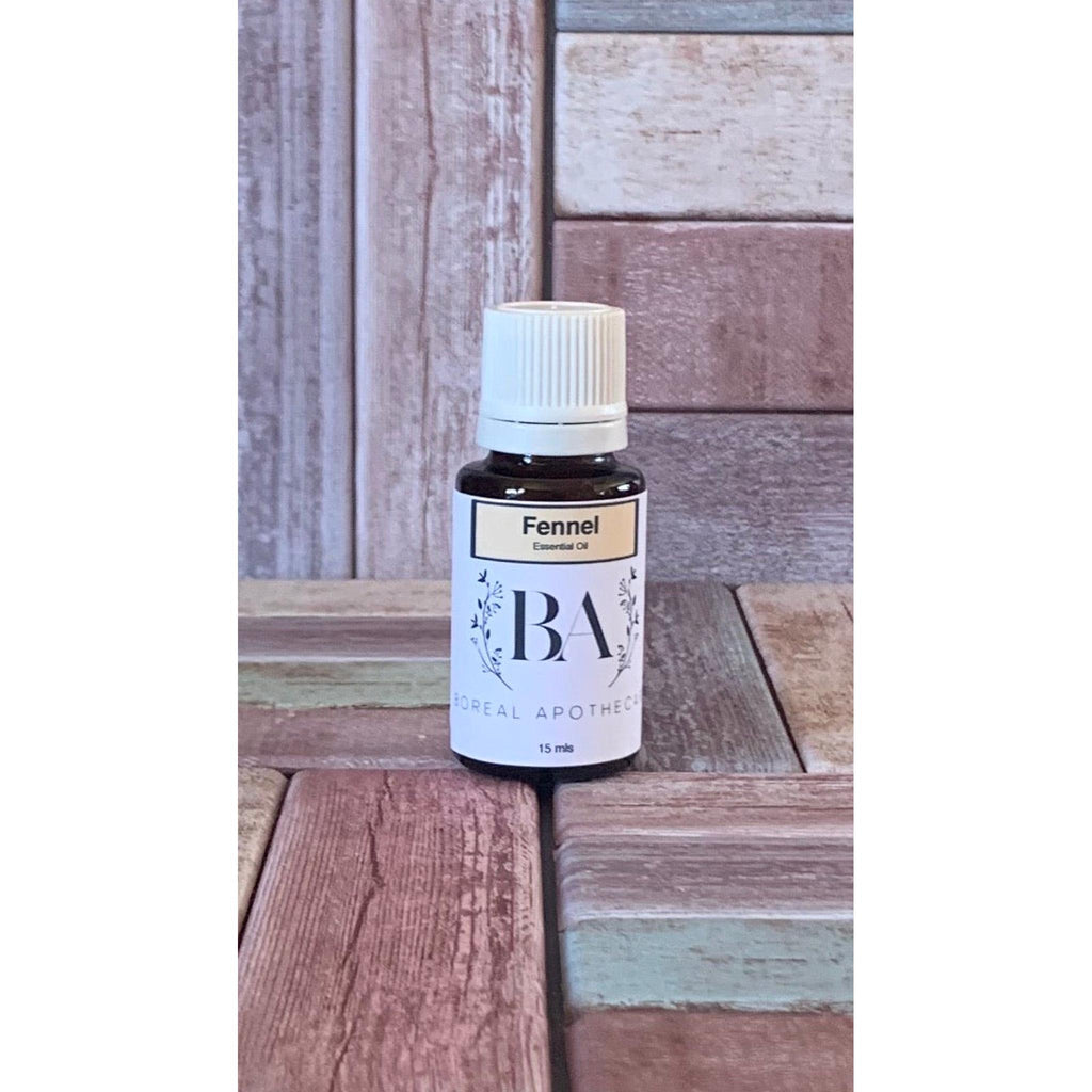 Bottle of Fennel essential oil from Real Apothecary on a wooden surface