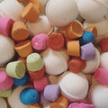 Colorful bath bombs in various shapes and sizes.