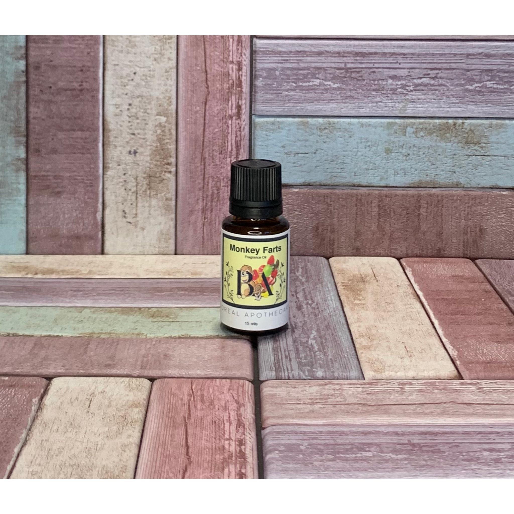 Bottle labeled 'Monkey Farts' on a wooden surface