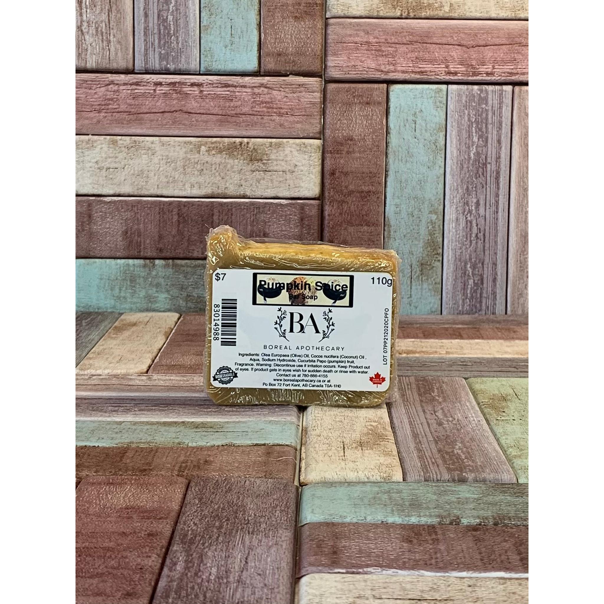 Bar of soap with a label on a wooden background