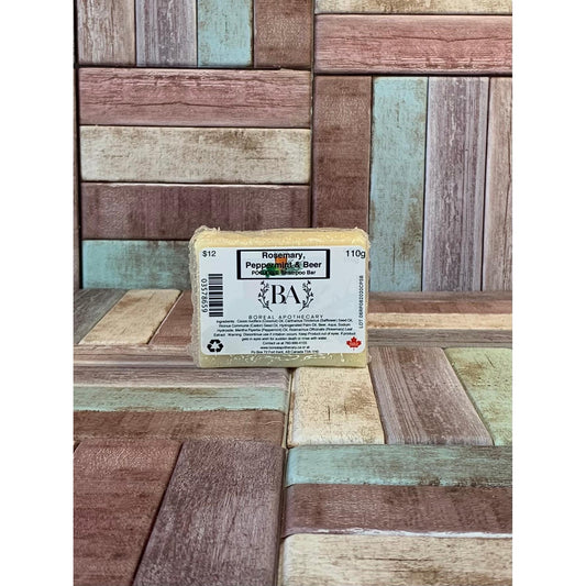 Bar of soap with a label on a wooden background