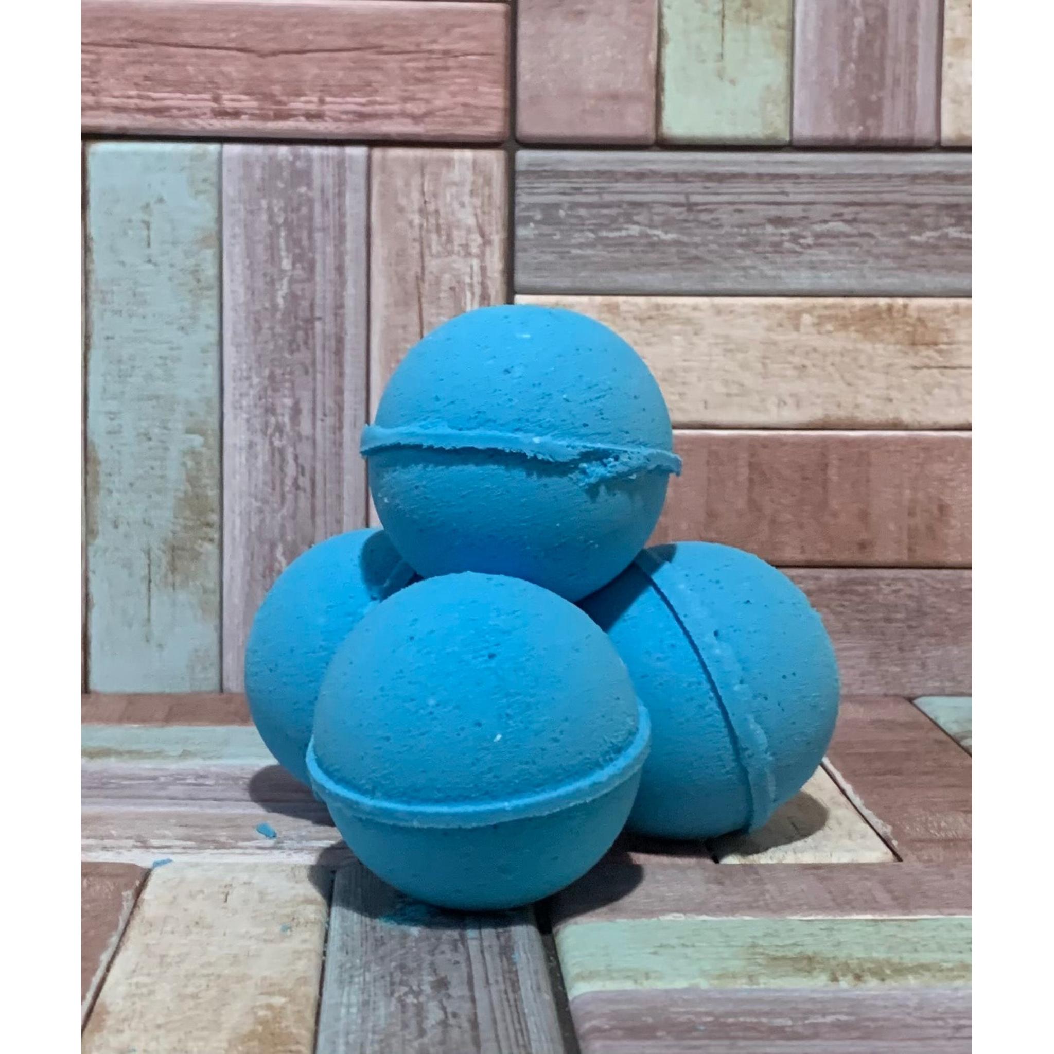 Blue bath bombs stacked on a wooden surface
