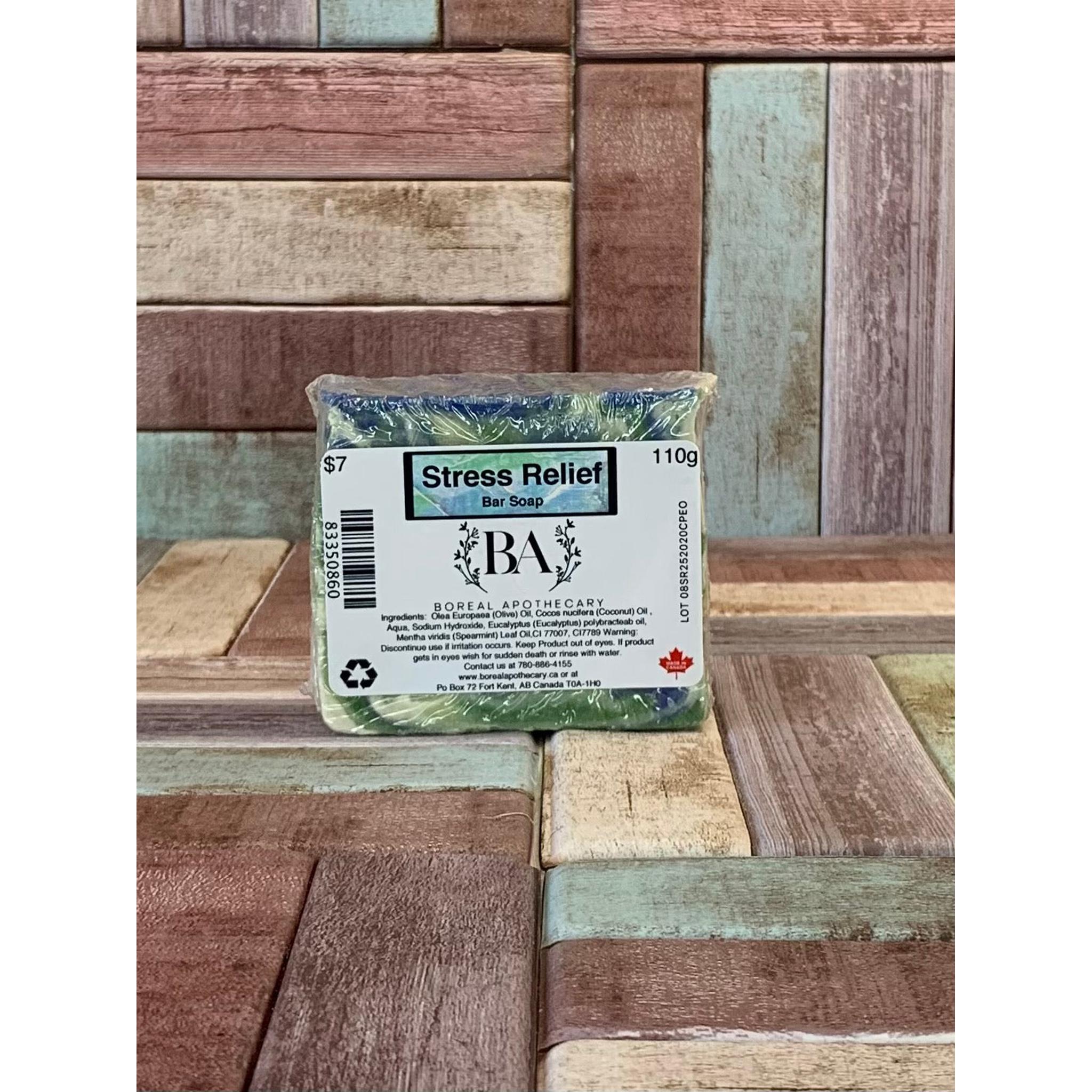 Bar of soap labeled 'Stress Relief' with 'BA' branding on a wooden background