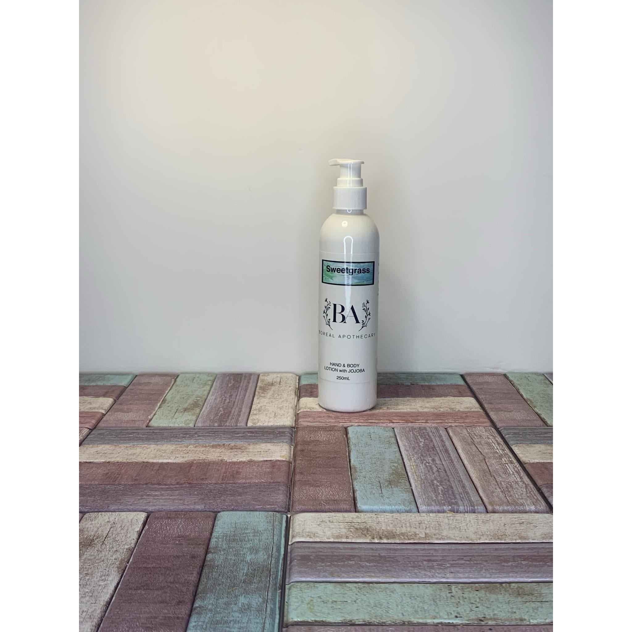 White bottle with a label on a wooden surface
